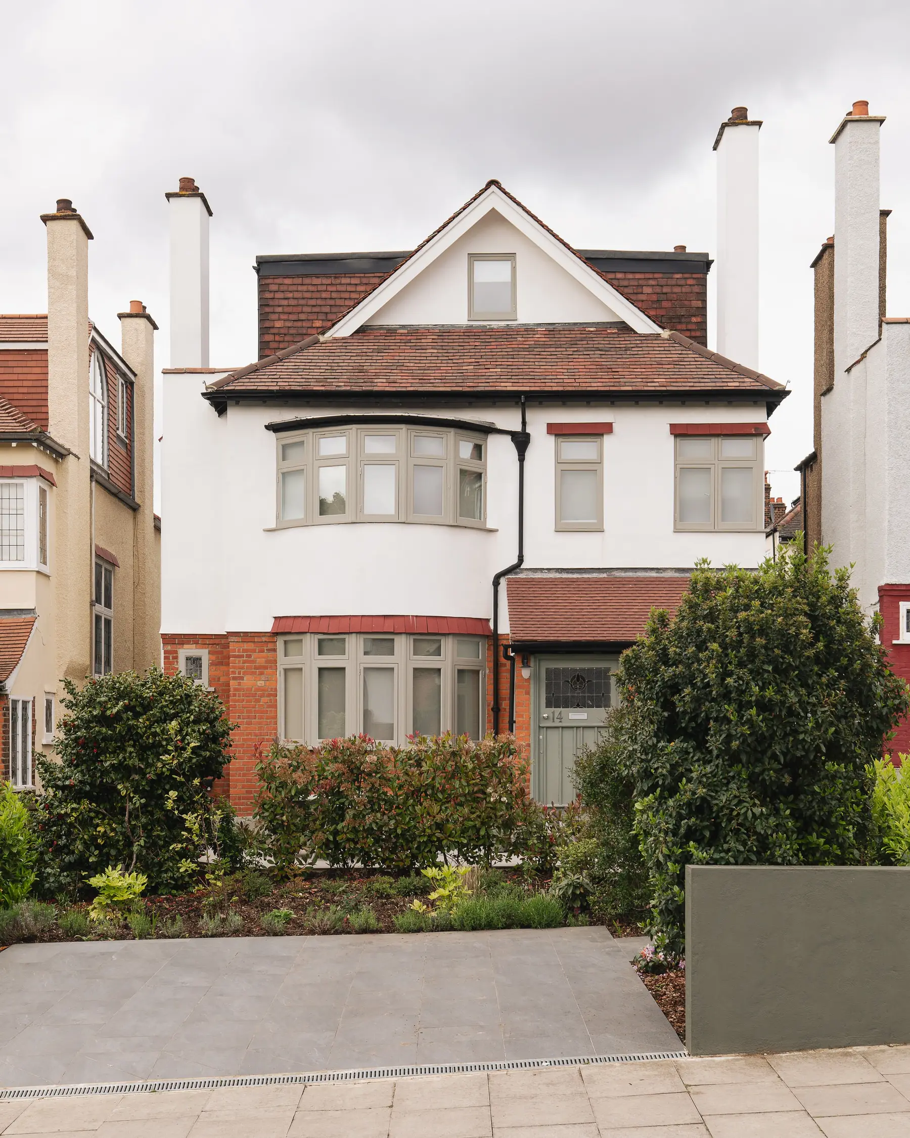 Red-brick Edwardian family house in Muswell Hill with a white gable