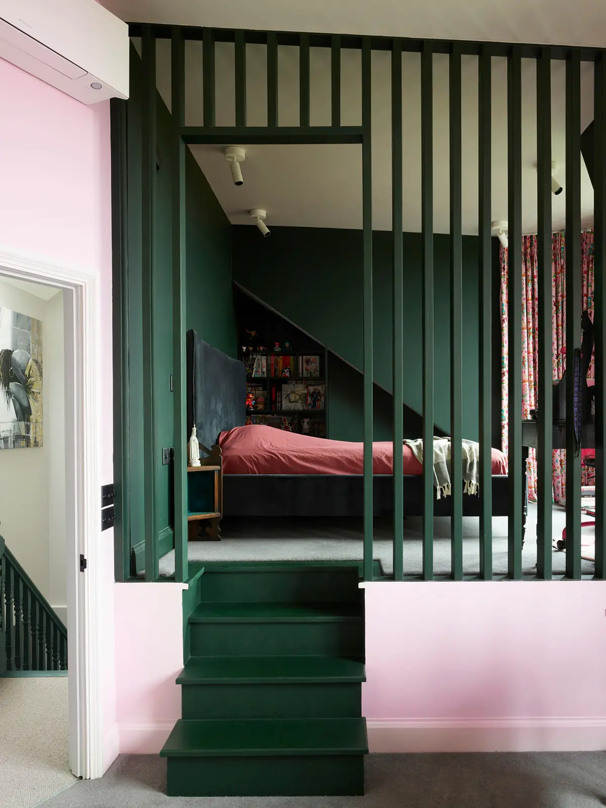Children's room with a dark green slatted cabin bed