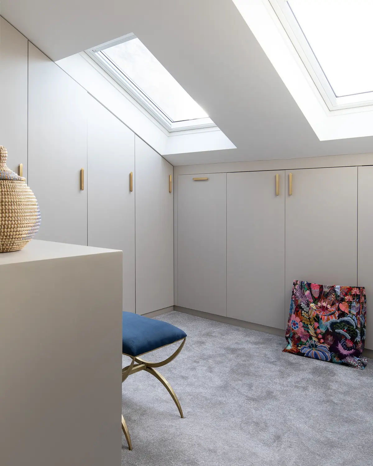Loft bedroom with fitted wardrobes under the eaves